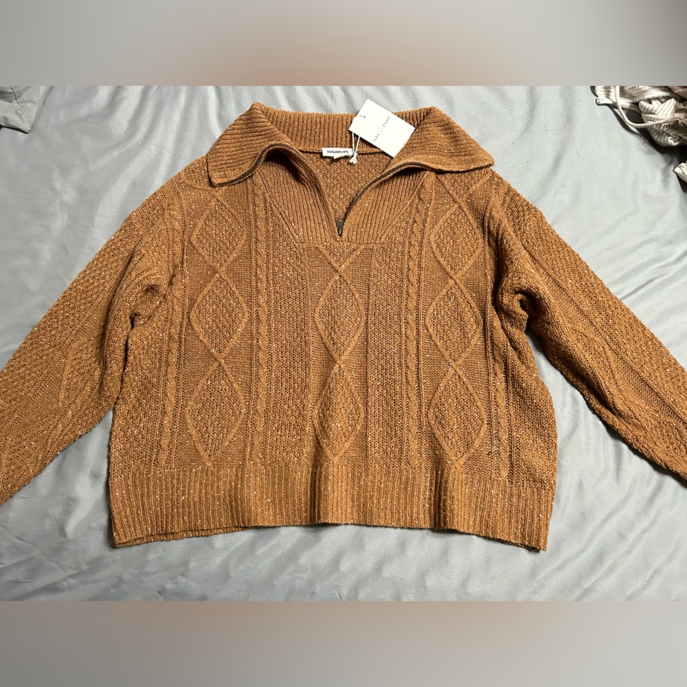 Brand new sweater with tags. Size x-small.